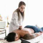 "A peaceful person lying on a therapy bed meditating during an acupuncture session, showing calmness and mind-body balance."